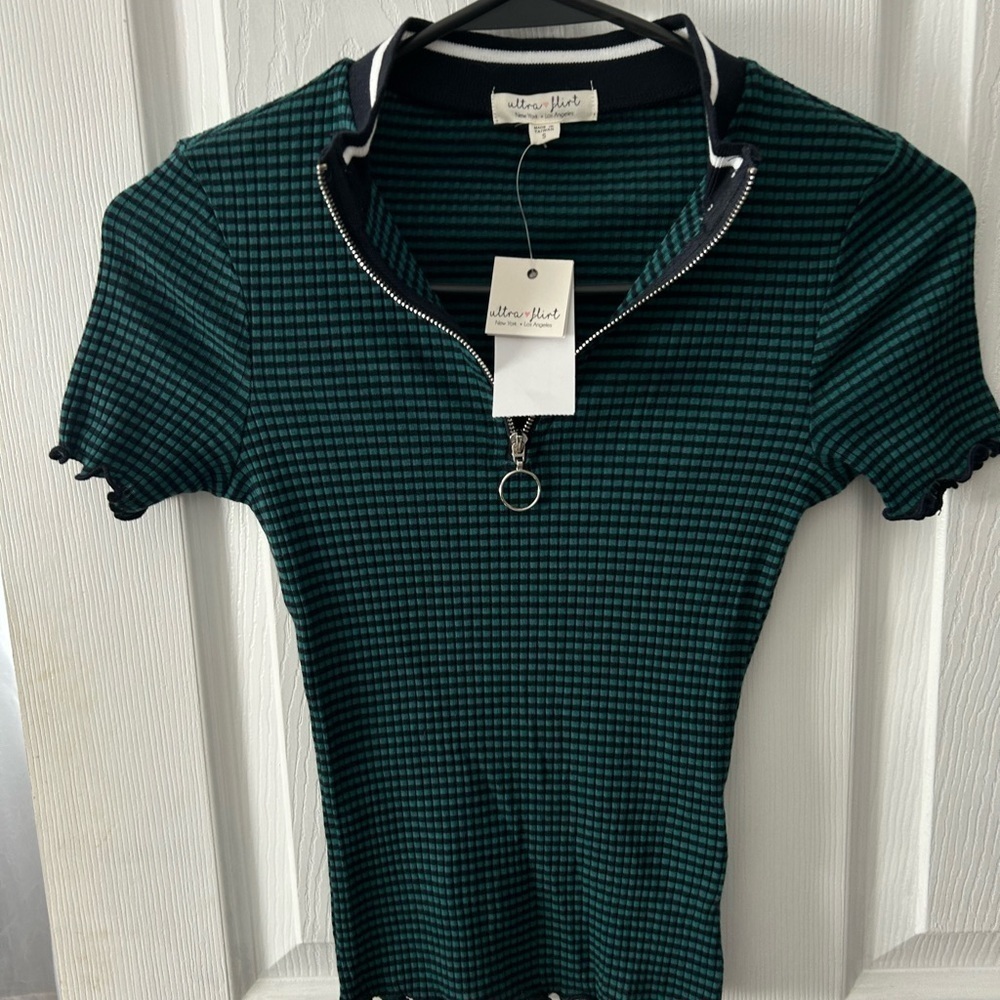 Black and green zip up top